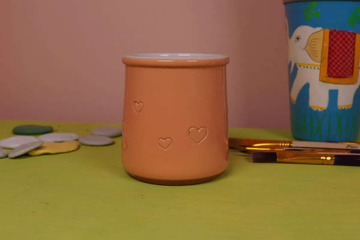 A rescued yogurt pot in the studio